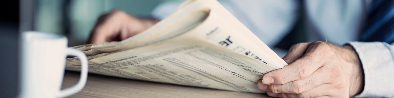 a person reading a newspaper