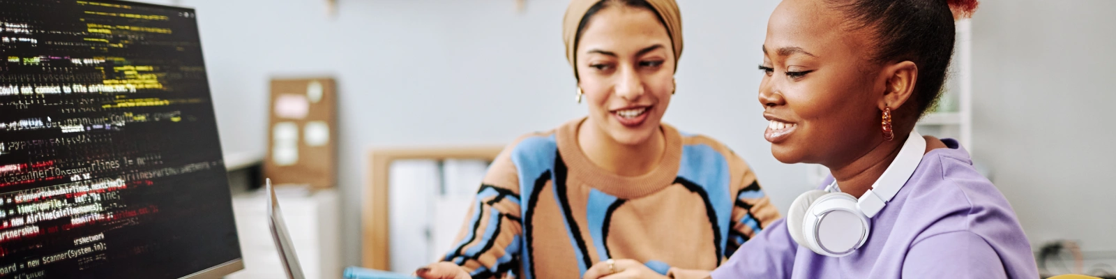 two people working on a computer